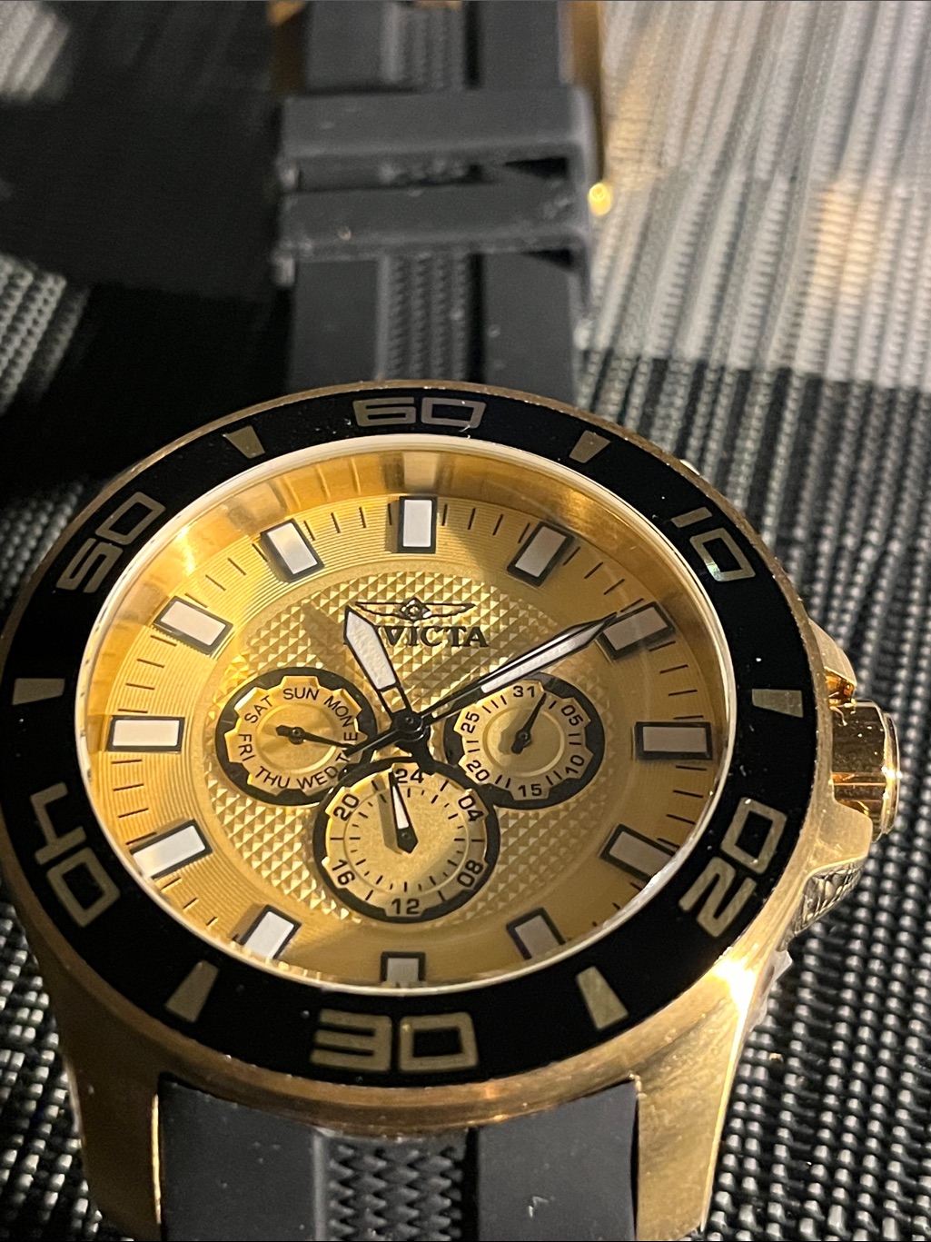 Invicta Gold Dial Watch With Black Bezel And Strap